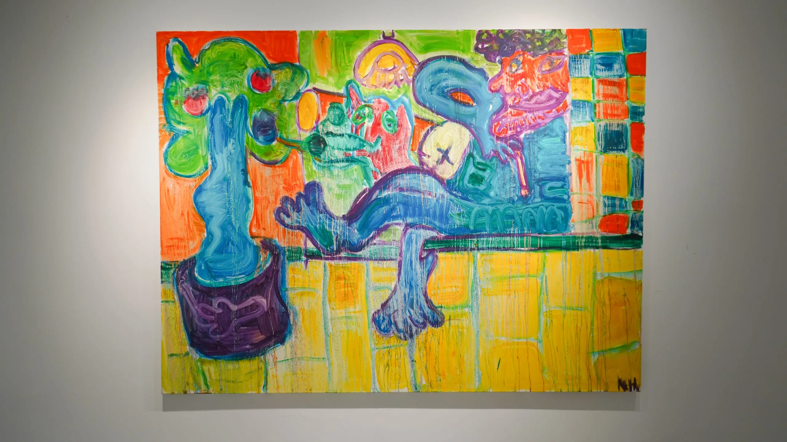 A surreal still life of blue, green and orange forms balanced against a chequered yellow ground.