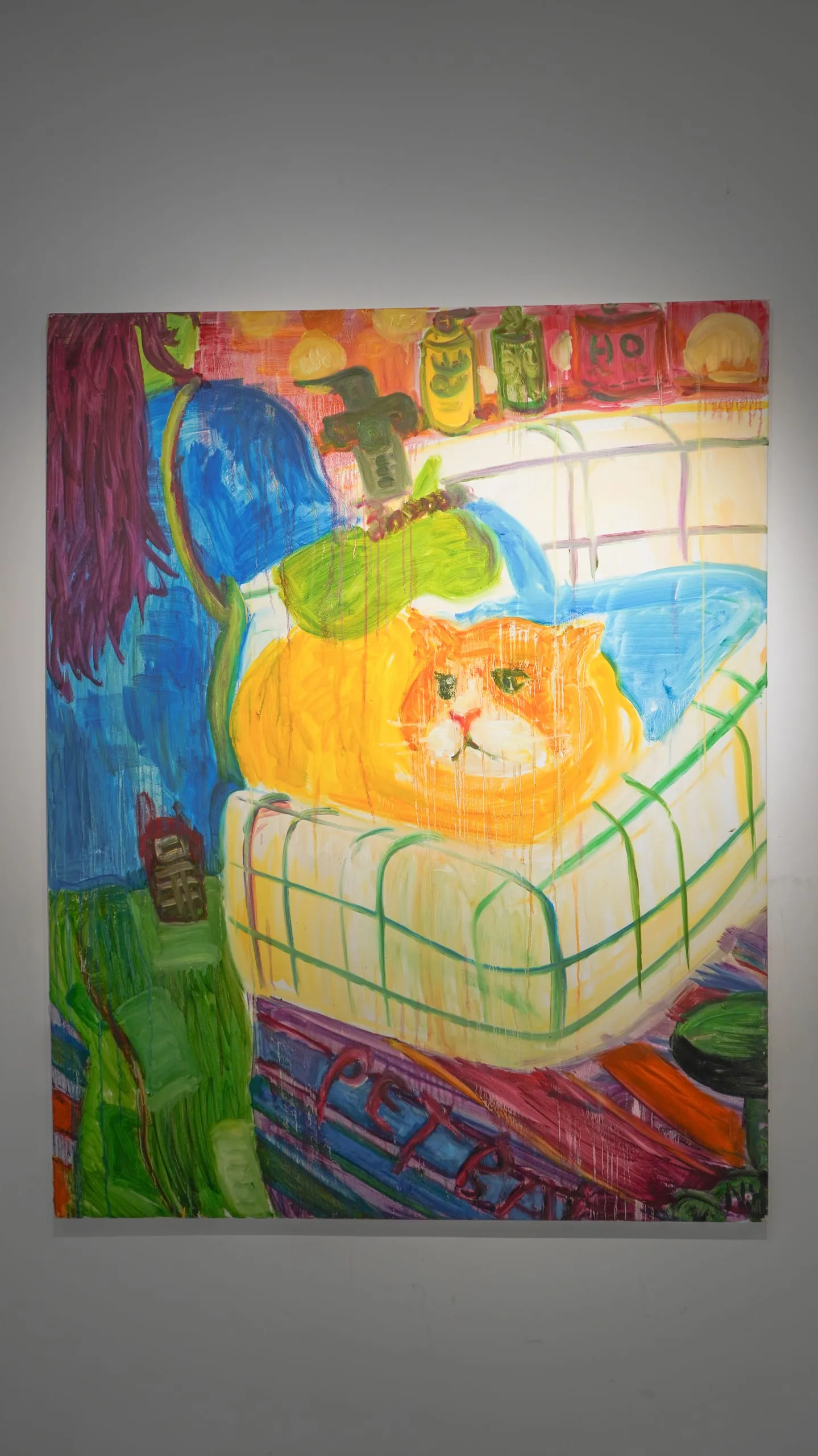 A ginger cat tucked under a green-checked blanket in a bed, surrounded by restless blue and red brushwork.