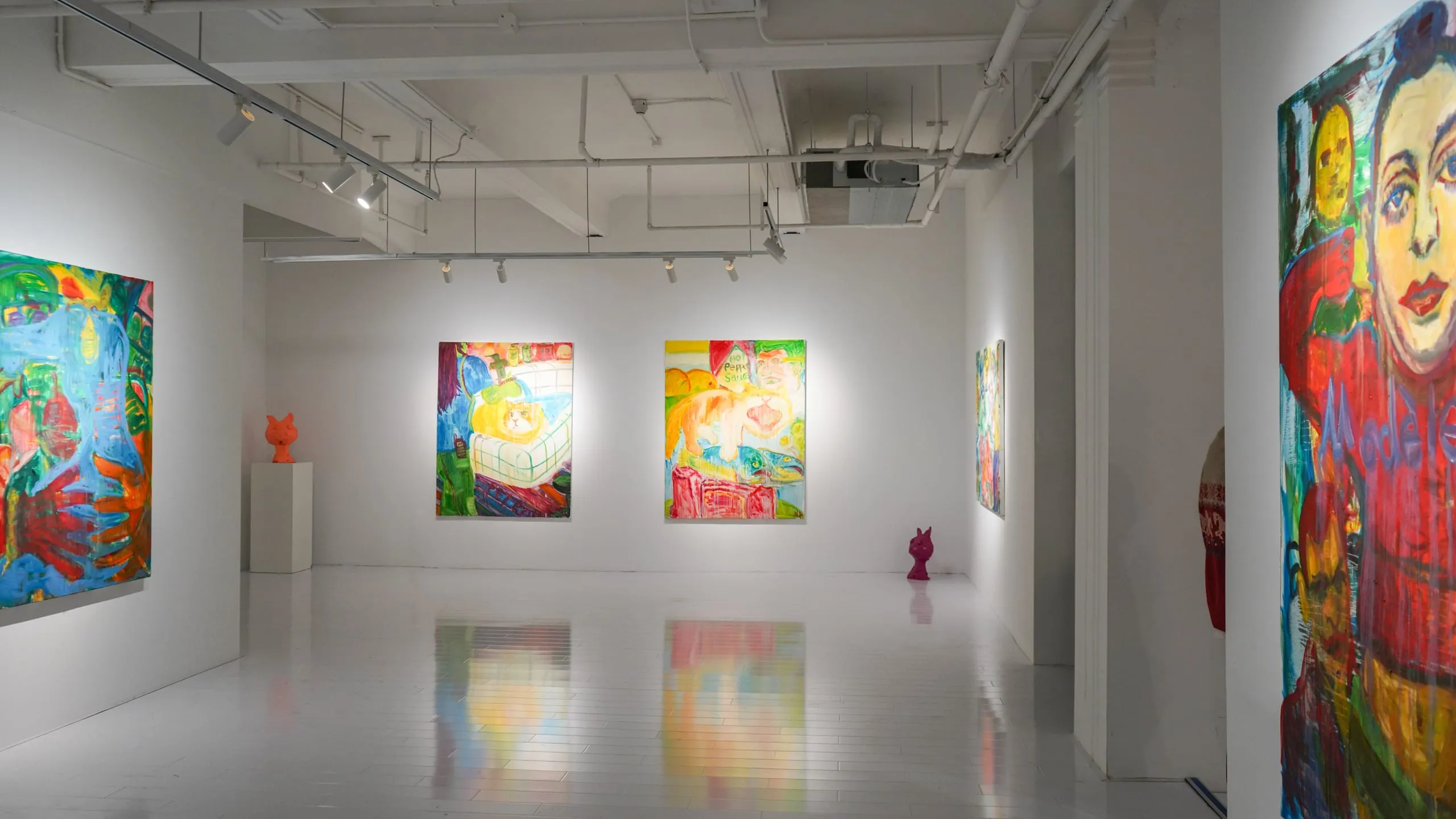 A wide view of the gallery: paintings across three walls reflected in a mirror-polished floor, a small sculpture on a plinth.